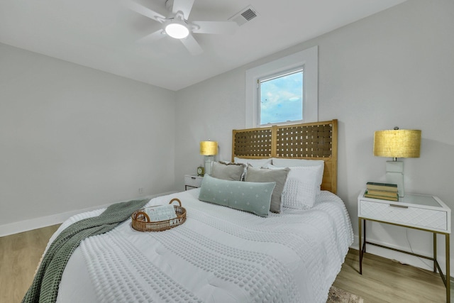 bedroom featuring light wood-type flooring and ceiling fan