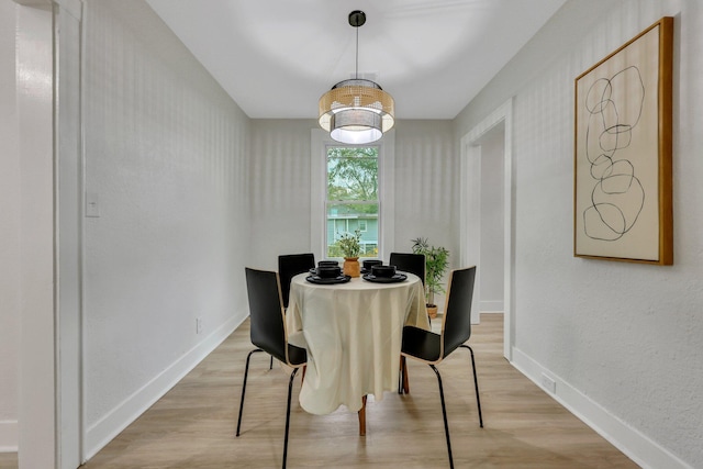 dining room with light wood-type flooring