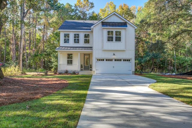 view of front of home with a porch, a garage, and a front lawn