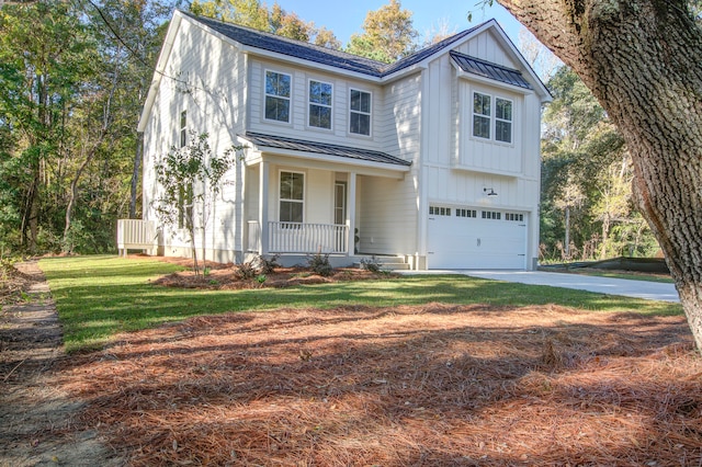 view of front of property with covered porch and a garage