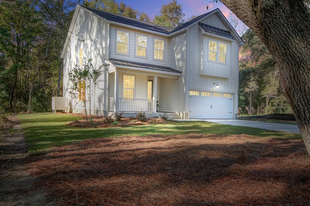 view of front of house featuring covered porch and a garage