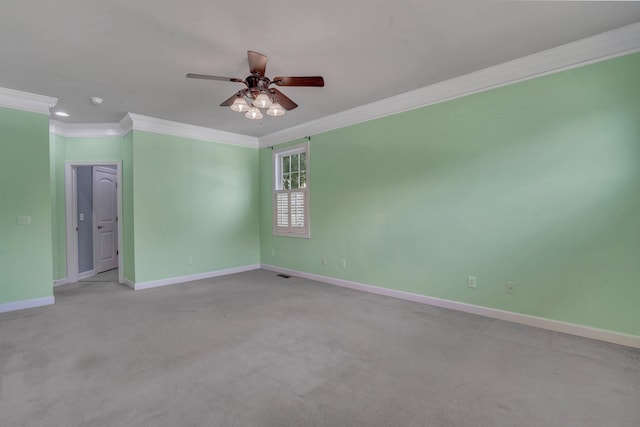 empty room featuring baseboards, a ceiling fan, ornamental molding, and light colored carpet