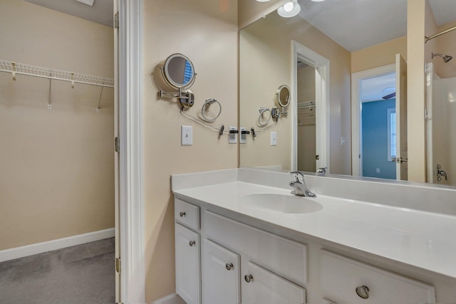 bathroom with baseboards and vanity