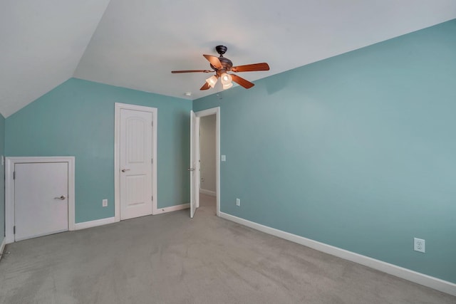 additional living space with baseboards, a ceiling fan, lofted ceiling, and light carpet