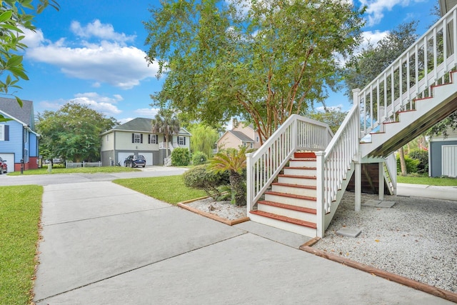 exterior space with a residential view and stairway