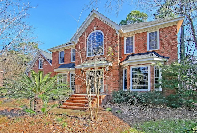 view of front of property featuring brick siding