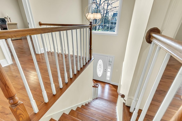 stairway featuring wood finished floors