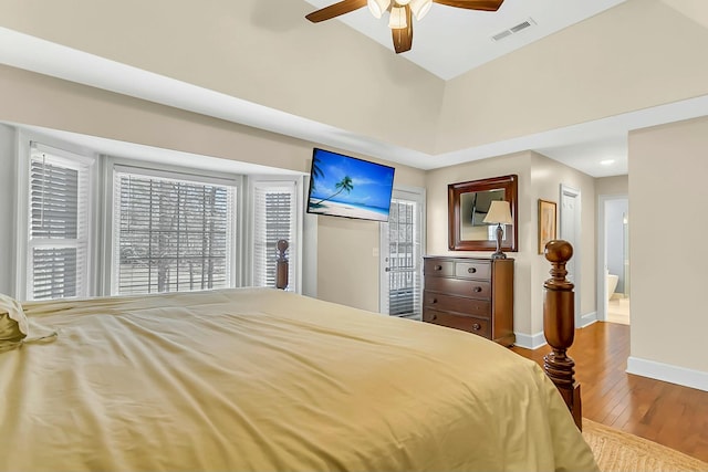 bedroom featuring a ceiling fan, visible vents, baseboards, access to outside, and wood-type flooring