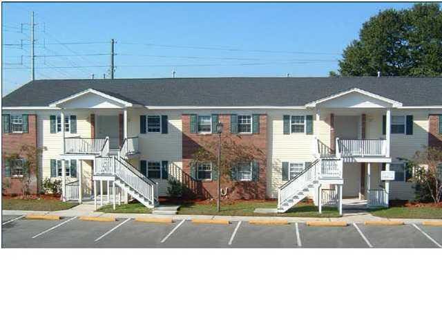 3930 Azalea Dr Unit W, North Charleston, SC 29405 - view of building exterior featuring stairs and uncovered parking