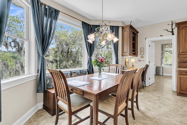 4702 Blockhouse Ln, Hollywood, SC 29449 - dining space with a chandelier, plenty of natural light, and baseboards