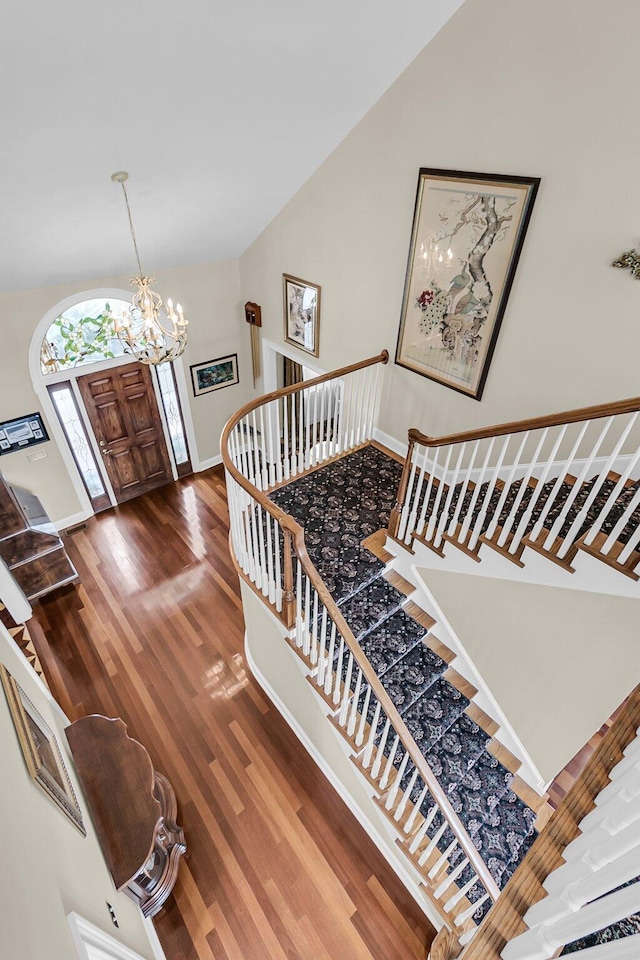 4702 Blockhouse Ln, Hollywood, SC 29449 - foyer with a chandelier, wood finished floors, baseboards, and high vaulted ceiling