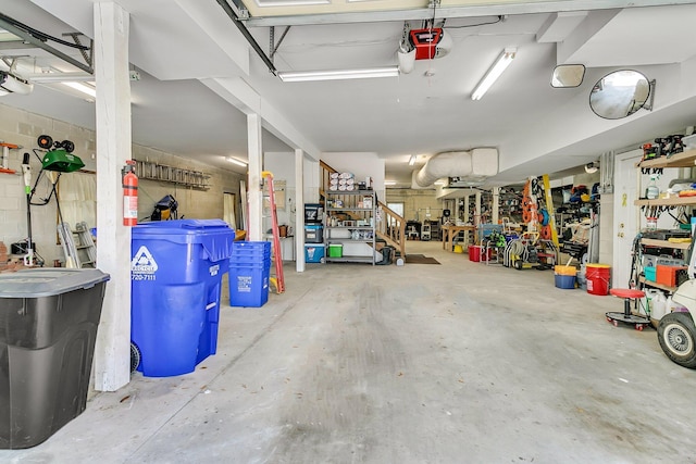 4702 Blockhouse Ln, Hollywood, SC 29449 - garage featuring a garage door opener and a workshop area