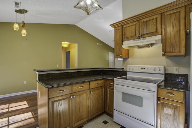 kitchen featuring electric range, visible vents, brown cabinets, a peninsula, and under cabinet range hood