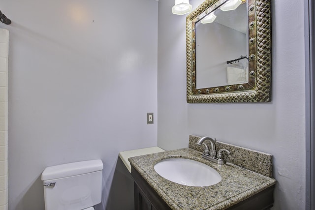 bathroom with vanity and toilet