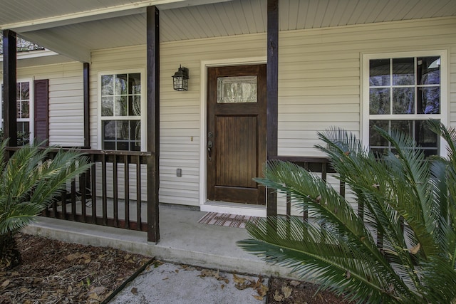 doorway to property featuring a porch