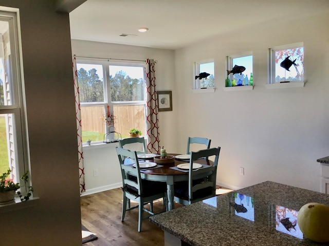 dining area featuring hardwood / wood-style floors