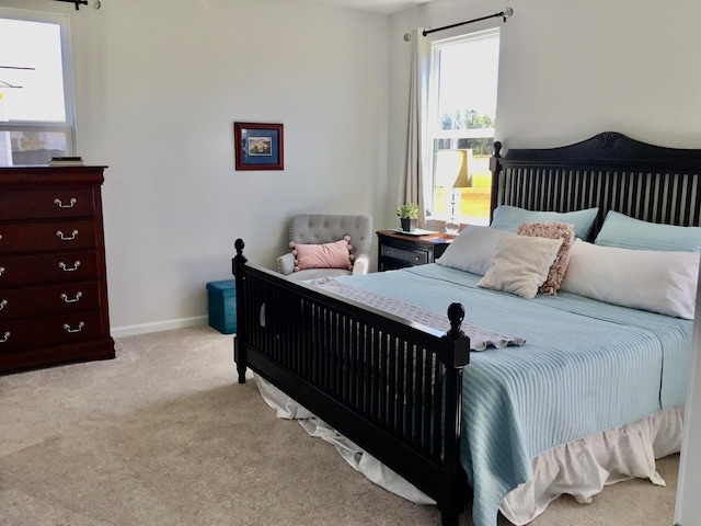 bedroom with light colored carpet