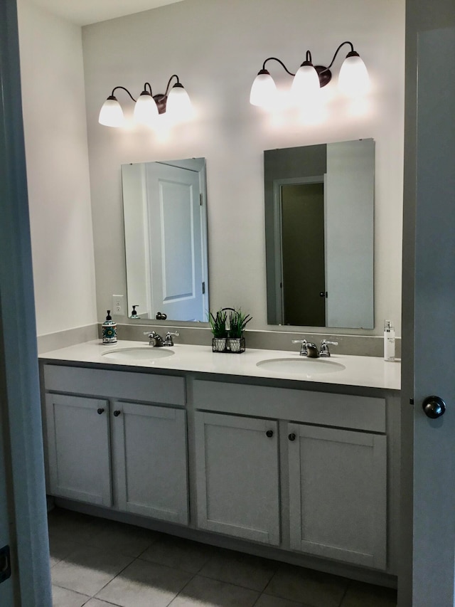 bathroom with tile patterned flooring and vanity