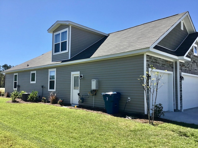 back of house with a lawn