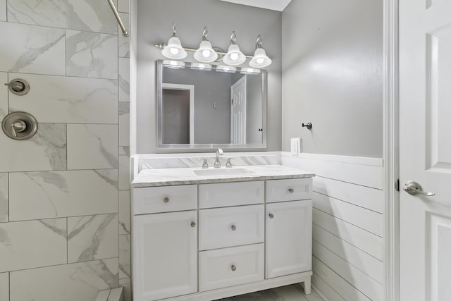 1245 Lakefront Dr, Charleston, SC 29412 - full bathroom featuring vanity, tiled shower, and a wainscoted wall