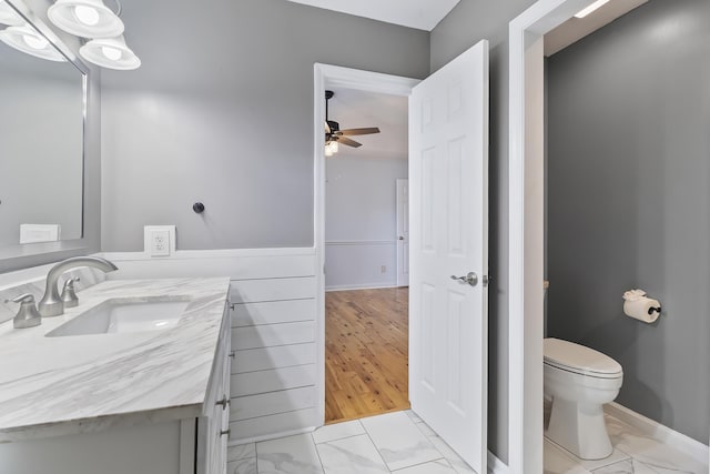 1245 Lakefront Dr, Charleston, SC 29412 - bathroom featuring marble finish floors, ceiling fan, vanity, and toilet