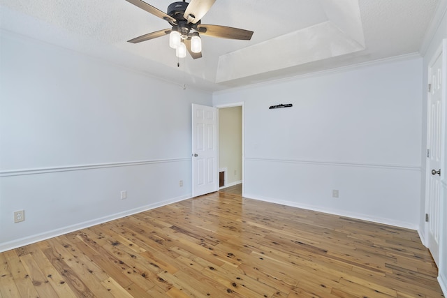 1245 Lakefront Dr, Charleston, SC 29412 - empty room featuring ceiling fan, hardwood / wood-style floors, a raised ceiling, ornamental molding, and baseboards