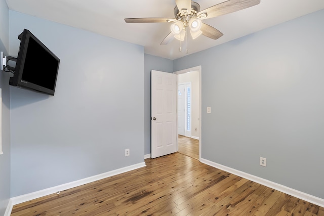 1245 Lakefront Dr, Charleston, SC 29412 - unfurnished bedroom with hardwood / wood-style flooring, baseboards, and a ceiling fan