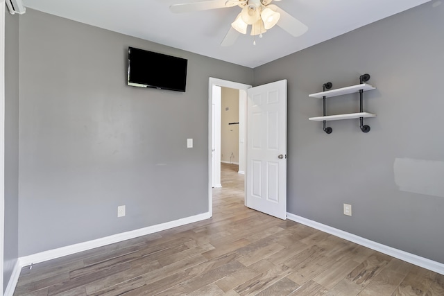 1245 Lakefront Dr, Charleston, SC 29412 - unfurnished bedroom with wood finished floors, baseboards, and ceiling fan