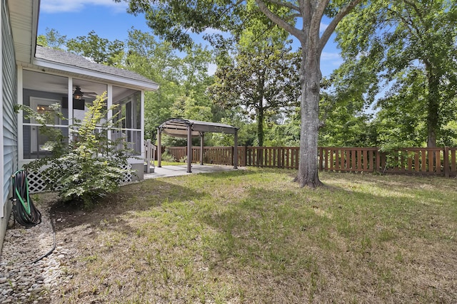 1245 Lakefront Dr, Charleston, SC 29412 - view of yard with a sunroom, ceiling fan, a patio area, and view of wooded area