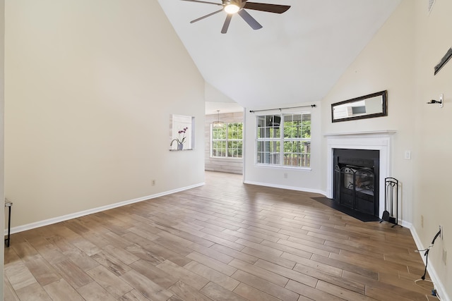 1245 Lakefront Dr, Charleston, SC 29412 - unfurnished living room with ceiling fan, high vaulted ceiling, a fireplace with flush hearth, baseboards, and wood finished floors