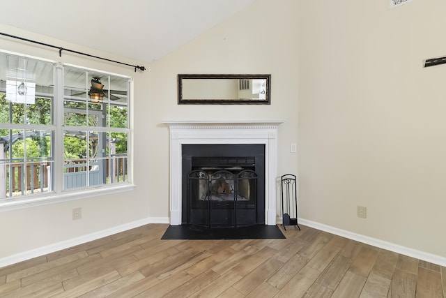 1245 Lakefront Dr, Charleston, SC 29412 - detailed view of wood finished floors, baseboards, a ceiling fan, and a fireplace with flush hearth