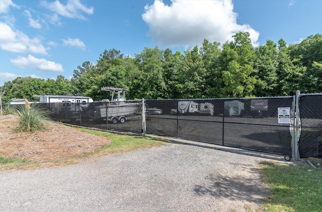 view of gate with fence