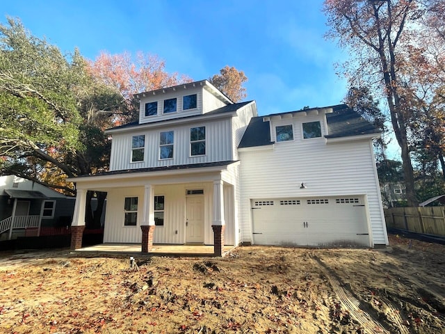 view of front of property with a garage and covered porch