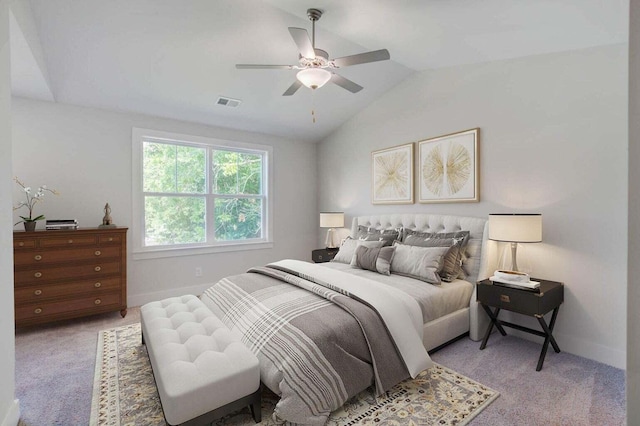 bedroom featuring light carpet, lofted ceiling, and ceiling fan