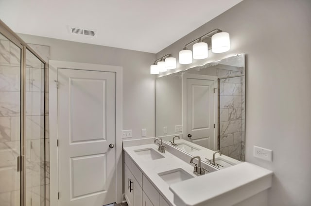 bathroom with vanity and an enclosed shower