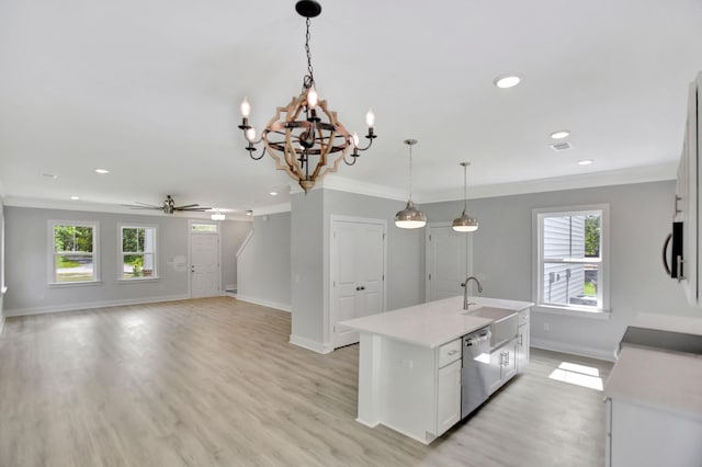 kitchen with sink, a center island with sink, ornamental molding, dishwasher, and pendant lighting