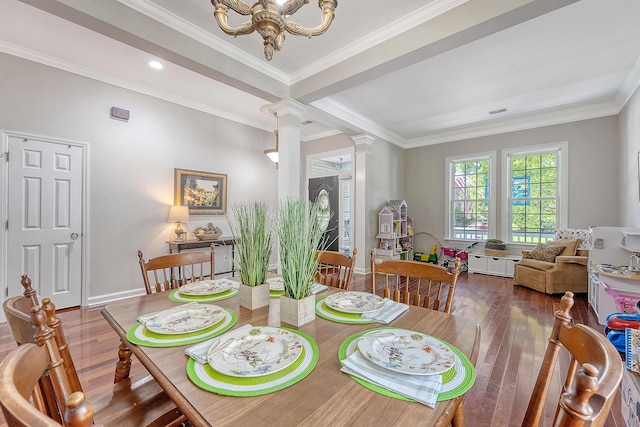 dining area with hardwood / wood-style flooring, ornamental molding, ornate columns, and a chandelier