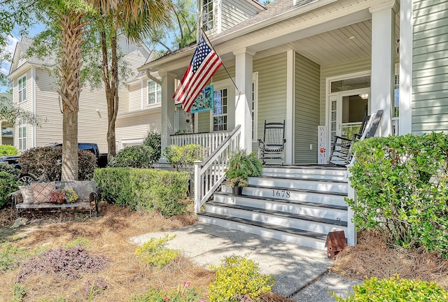 property entrance with covered porch