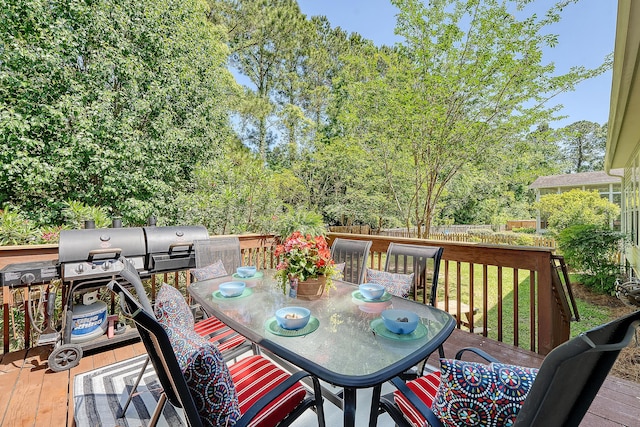 wooden deck featuring fence and outdoor dining area