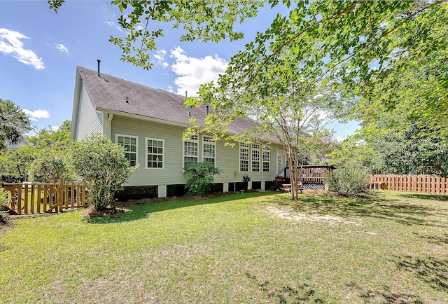 exterior space with fence and a deck