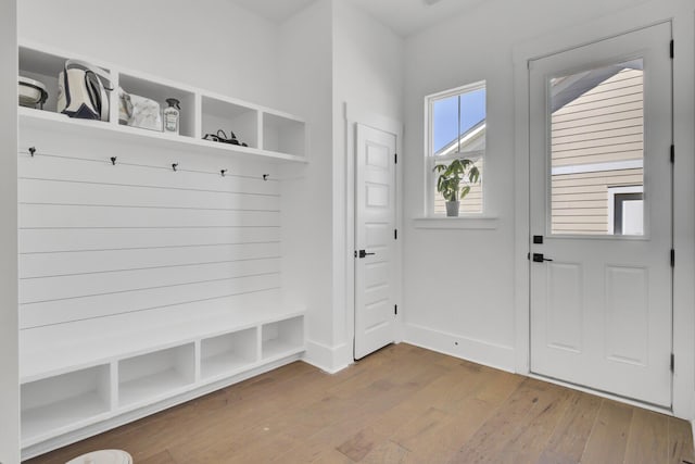 mudroom with hardwood / wood-style floors and baseboards