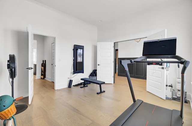 workout room with light wood-style flooring