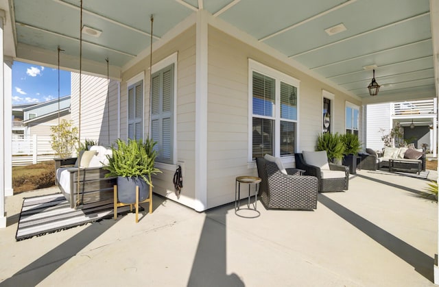 view of patio / terrace with a porch and an outdoor living space