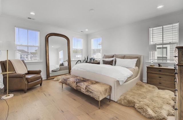 bedroom featuring recessed lighting, visible vents, and light wood-type flooring