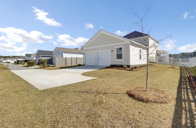 view of property exterior featuring a yard, a garage, concrete driveway, and fence