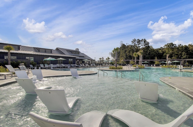 pool with a patio area