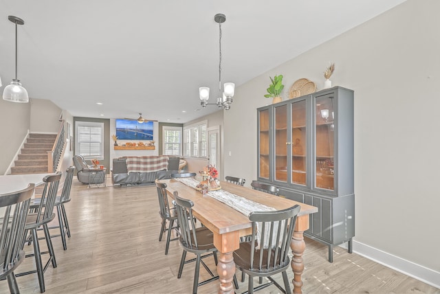 dining room featuring light hardwood / wood-style flooring and a chandelier