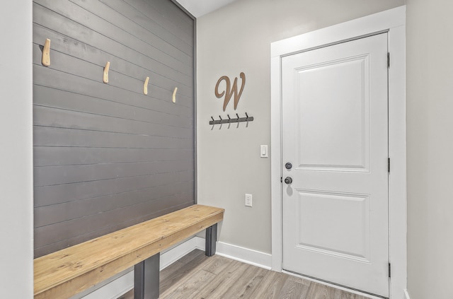 mudroom with light hardwood / wood-style flooring