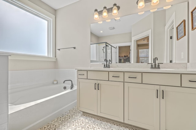 bathroom featuring vanity, separate shower and tub, and tile patterned floors