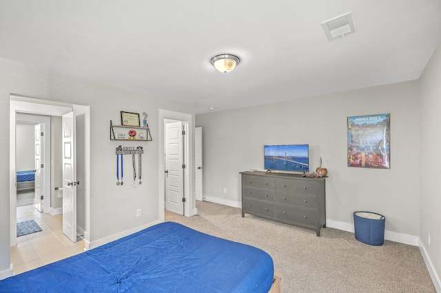 bedroom featuring light carpet